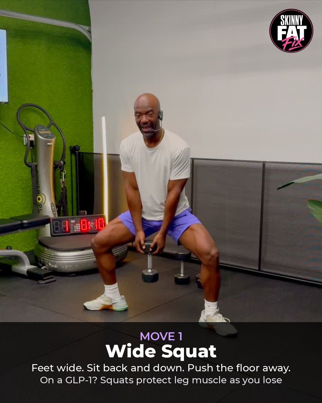 Coach RJ demonstrating the sit-to-stand squat with a dumbbell